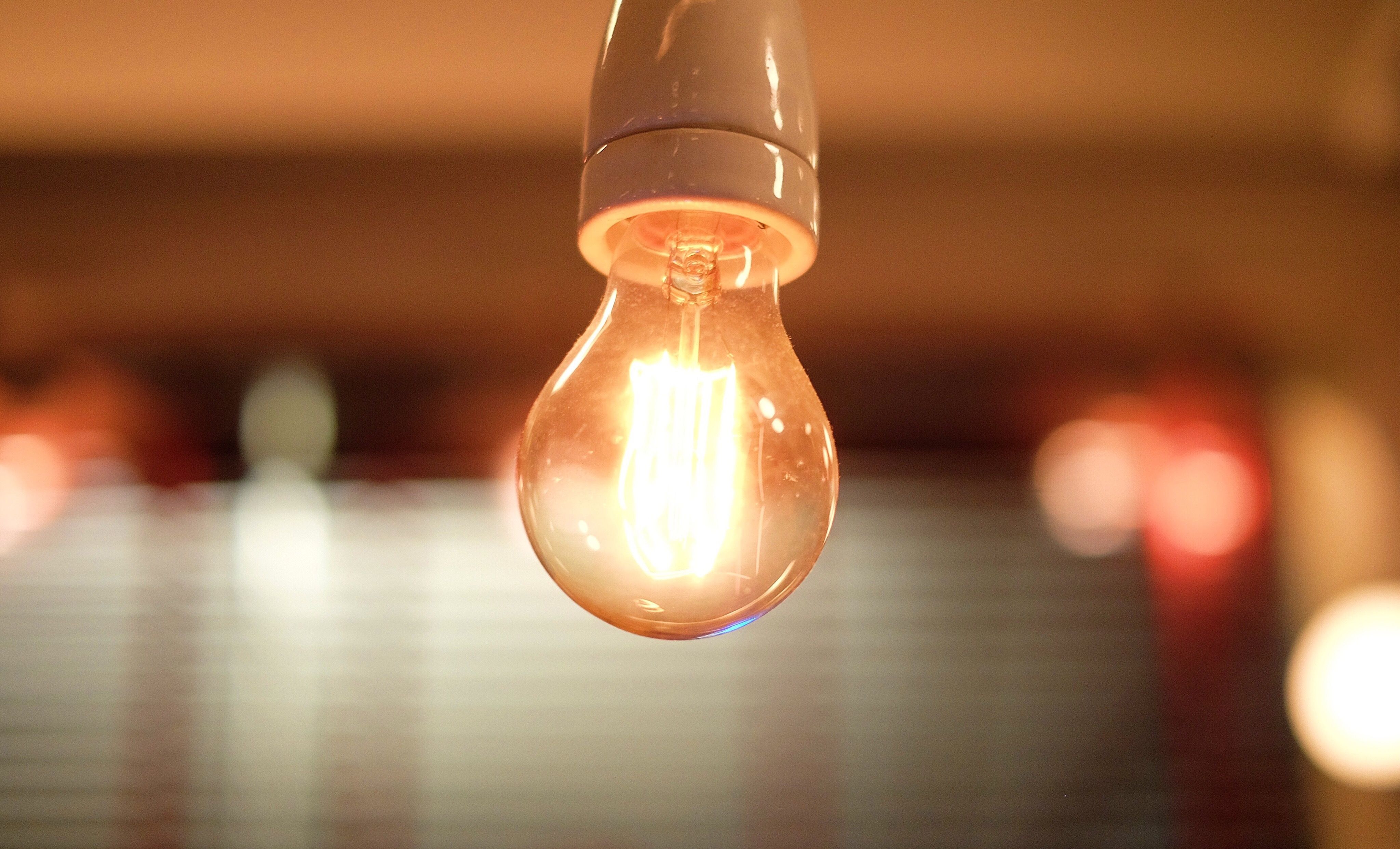close-up-of-illuminated-light-bulb-in-room-672210467-587926a83df78c17b6cbe9d2